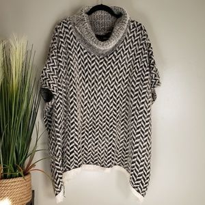 Fluffy black and grey poncho